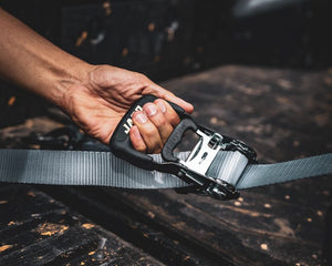 JACO Heavy Duty ratchet strap securing cargo in pickup truck bed for safe highway transport