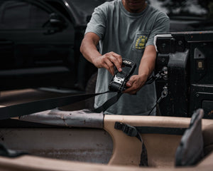 JACO ratchet strap securing a kayak on a truck bed