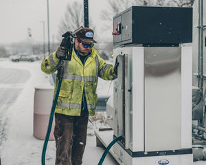 Pickup truck refueling at a gas station, representing truck and SUV fuel economy tips